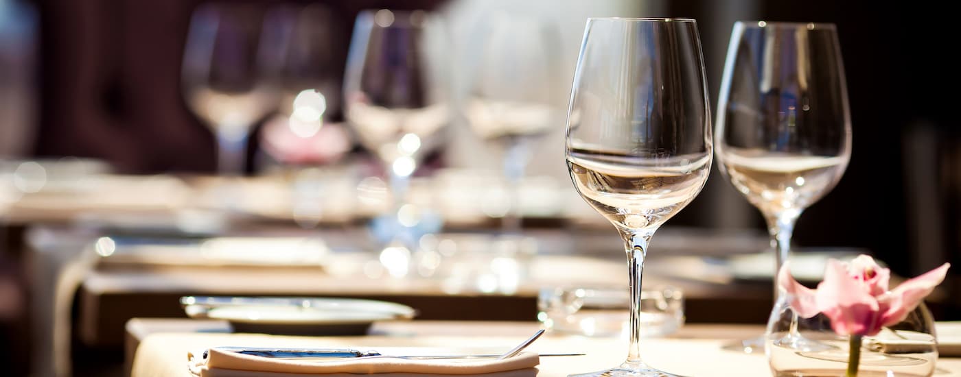 Tables are set up at a fine dining restaurant near a Cadillac dealer near you.