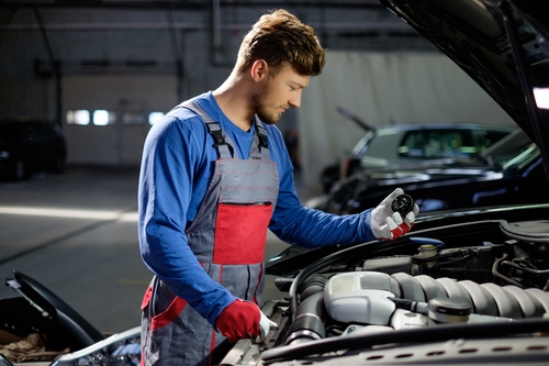 mechanic performing regular car maintenance