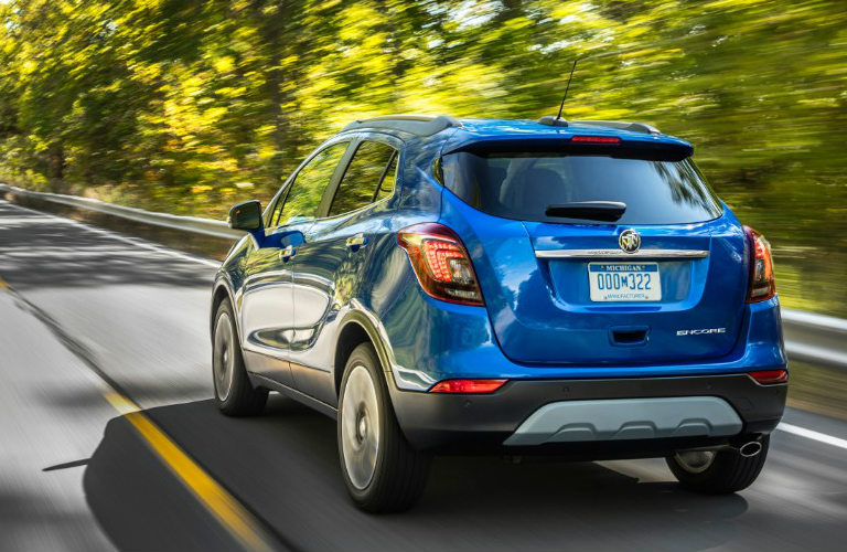 photo of a 2019 Buick Encore driving on highway exterior rear view
