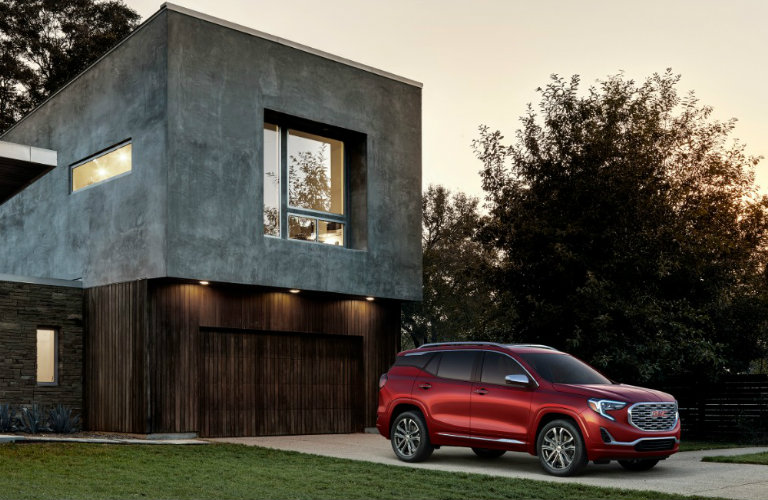 2019 GMC Terrain Denali parked in front of a fancy house